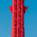 Career Ladder - A red tower with a red and white sign