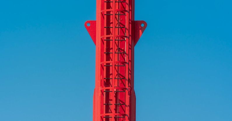 Career Ladder - A red tower with a red and white sign