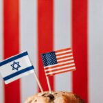 Business Integrity - Tasty muffin with national flags of USA and Israel