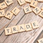 Trade Agreements - Trade and trade related words on wooden table