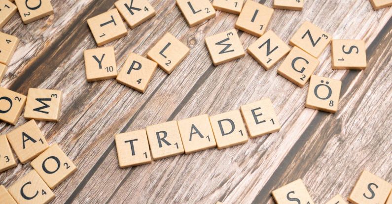 Trade Agreements - Trade and trade related words on wooden table