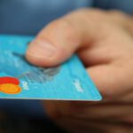 E-commerce Personalization - Person Holding Debit Card