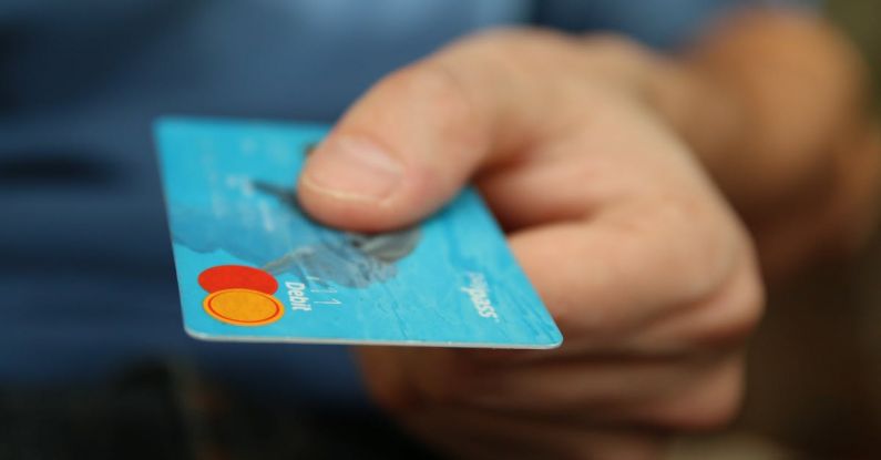 E-commerce Personalization - Person Holding Debit Card