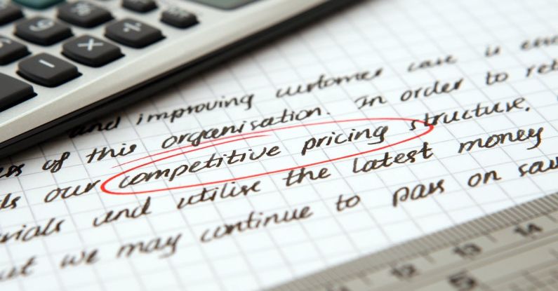 Pricing Strategy - Competitive Pricing Handwritten Text Encircled on Paper