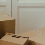 Overcoming Procrastination - Brown Cardboard Box on White Wooden Door