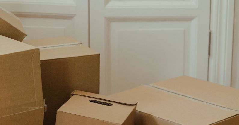 Overcoming Procrastination - Brown Cardboard Box on White Wooden Door