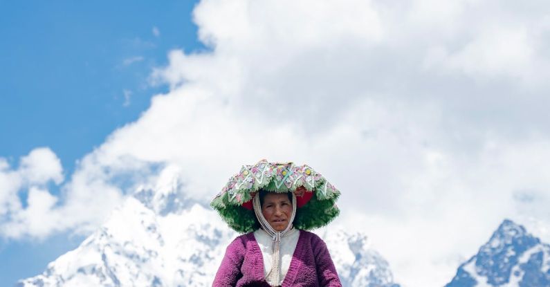 Cloud Solutions - A woman in a traditional dress stands in front of mountains