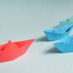 Legacy Leadership - Paper Boats on Solid Surface