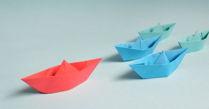 Legacy Leadership - Paper Boats on Solid Surface